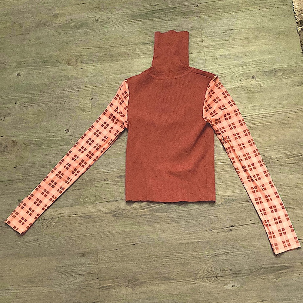 this is a pink sweater with beautiful pink sleeves that are see-through.